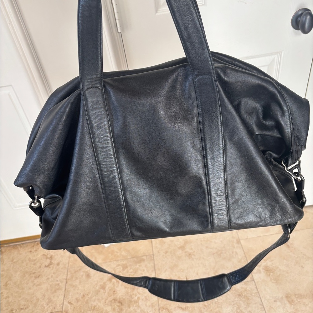Tumi Black Duffel Bag with Modern Design and Functionality
